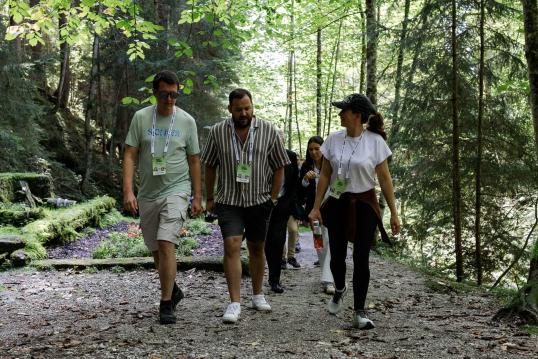 Kata Tüttő, President of the European Committee of the Regions, engaging in discussion with participants during the Walking Dialogue